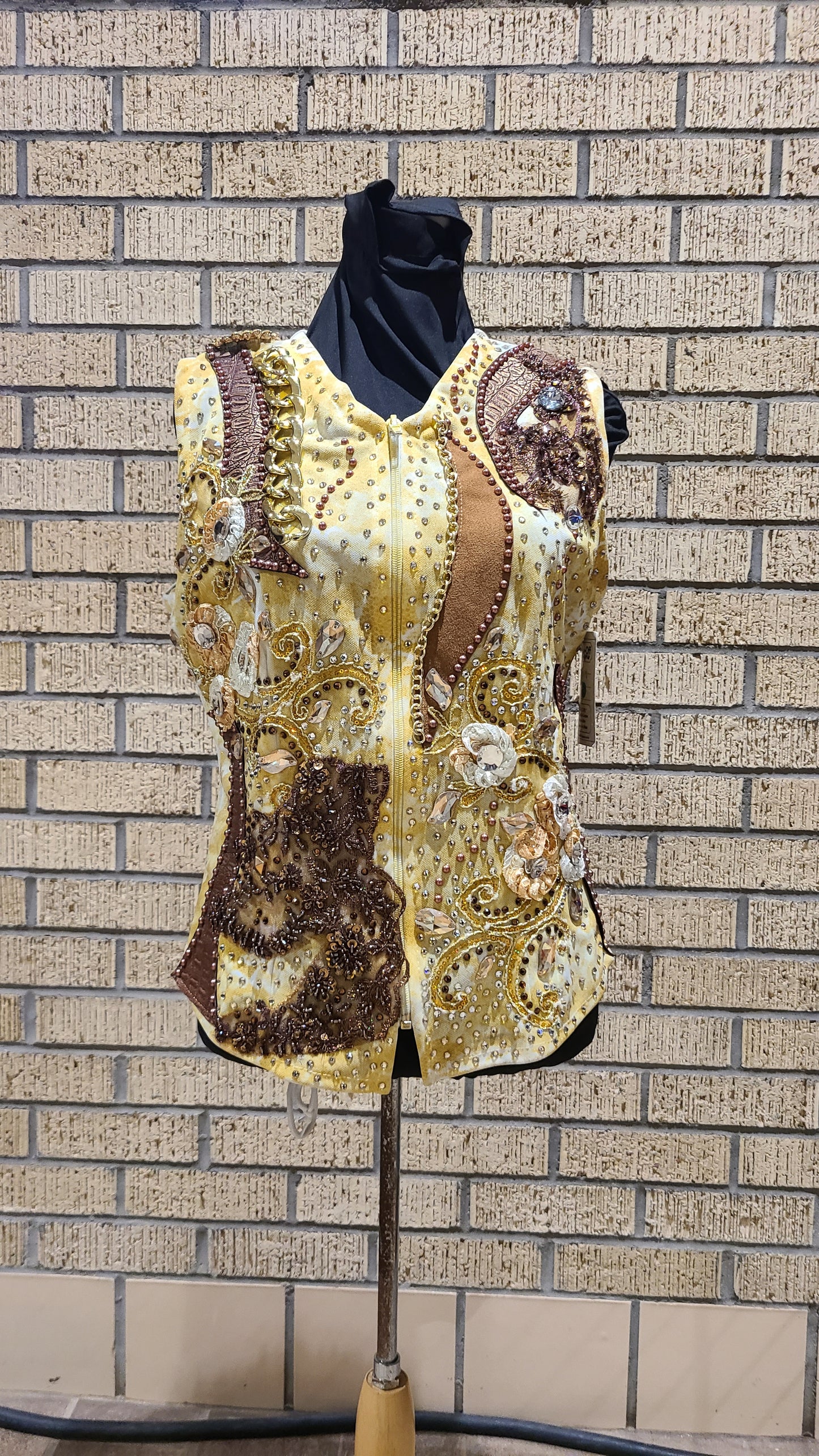 Size small gold airbrushed design with brown leather and golds