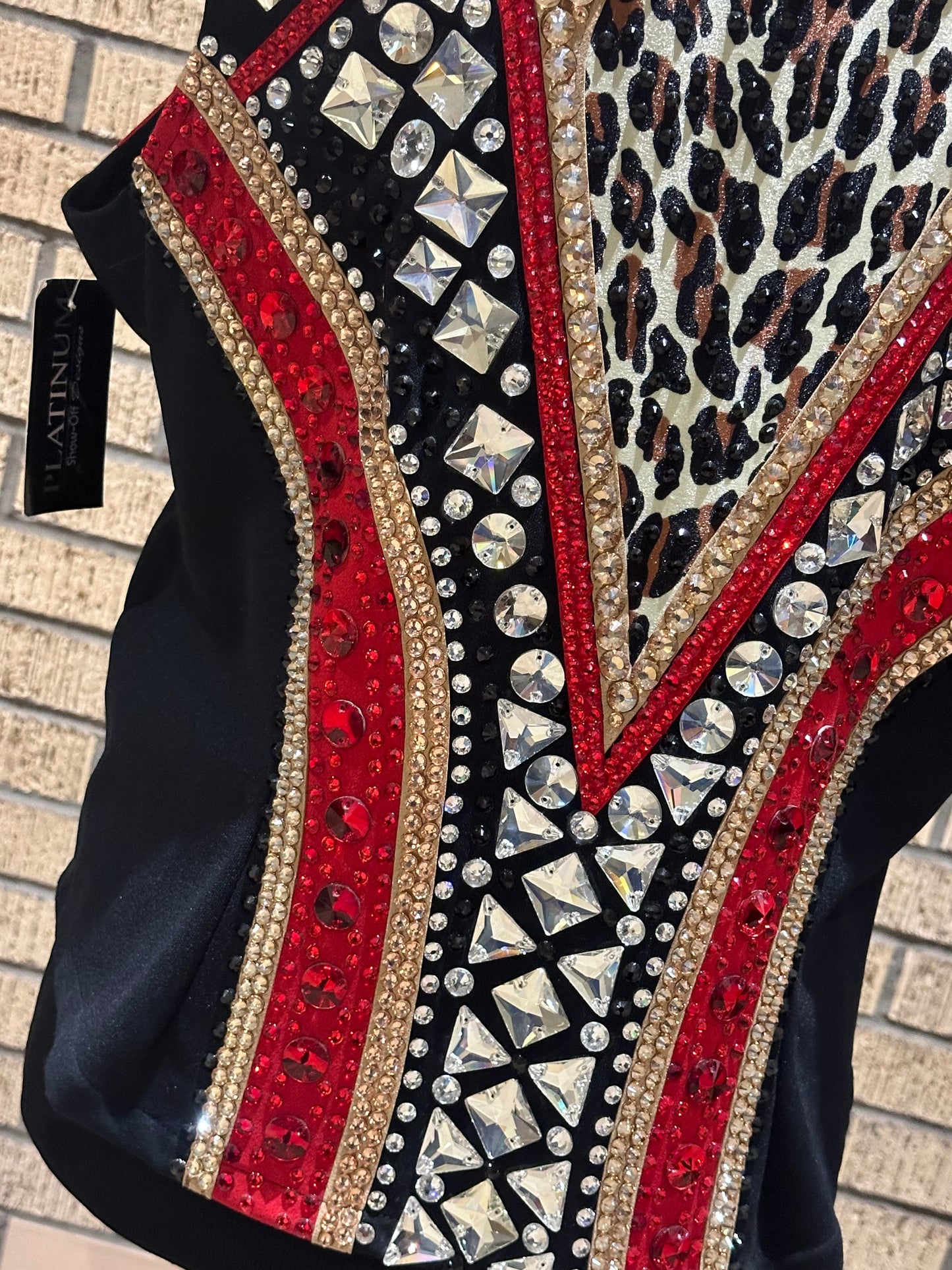 Large vest with black, gold and red with clear crystals and leopard print