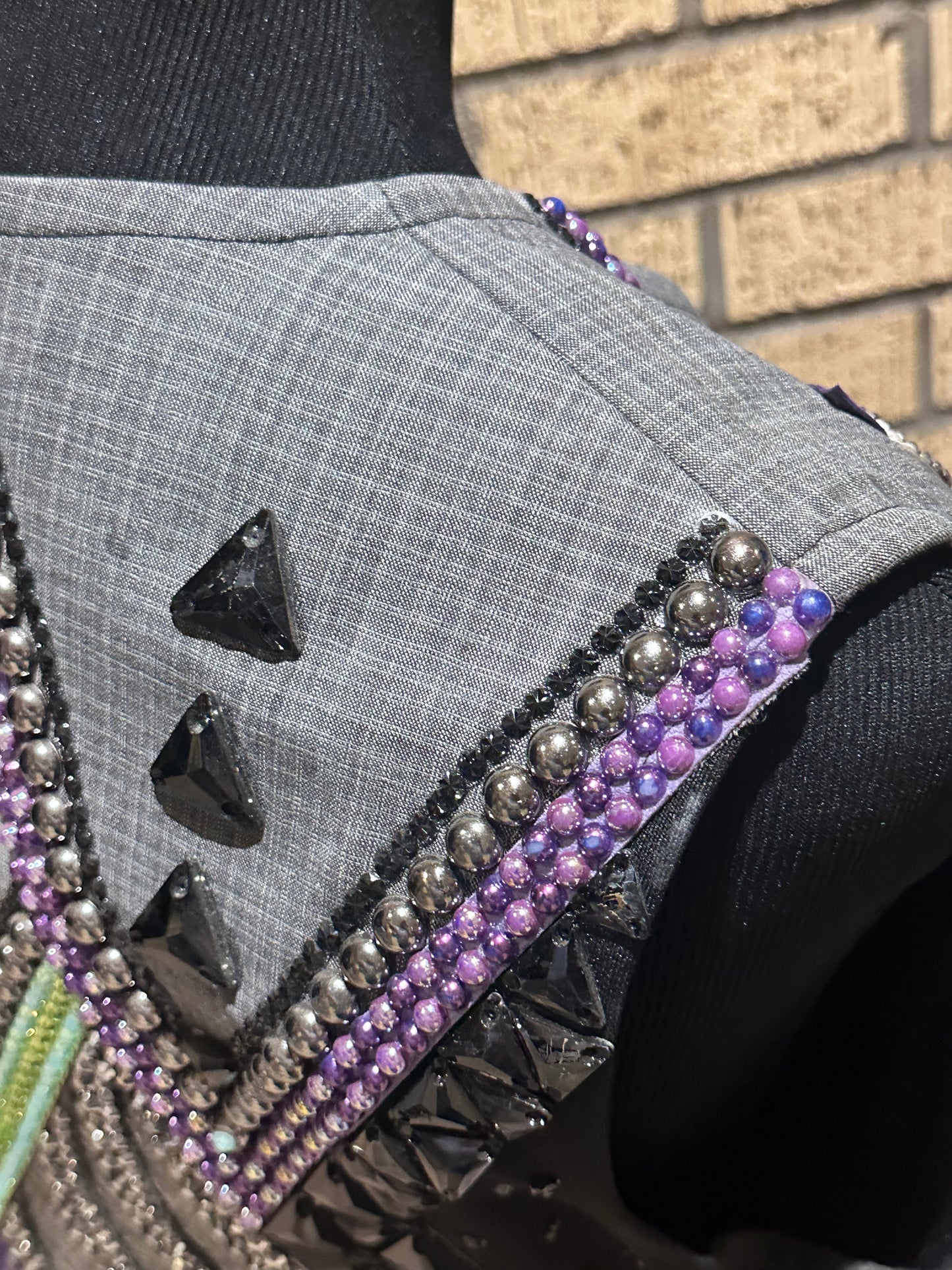 Size medium vest with silver, charcoal grey, purple and a hint of green