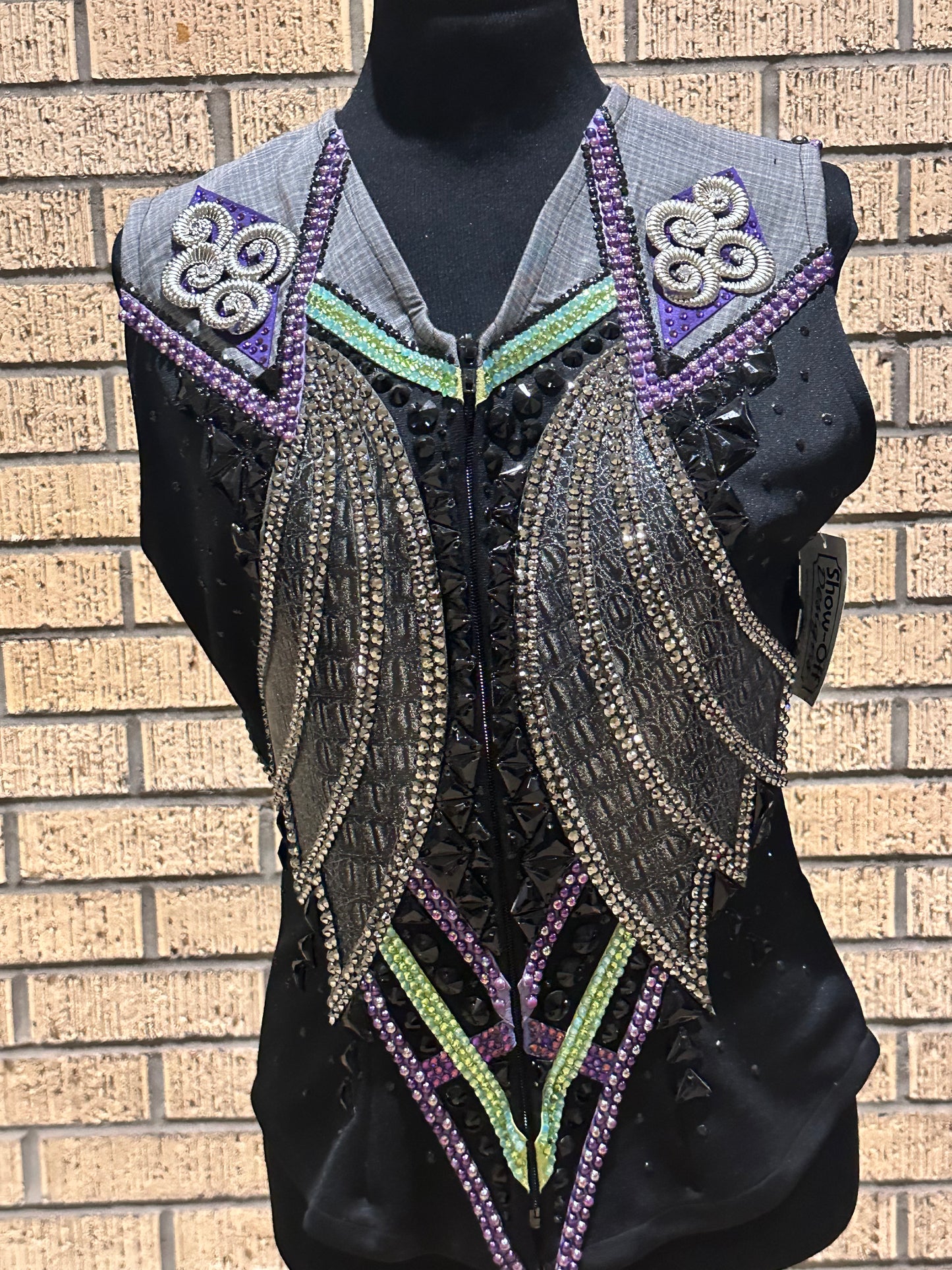 Size medium vest with silver, charcoal grey, purple and a hint of green