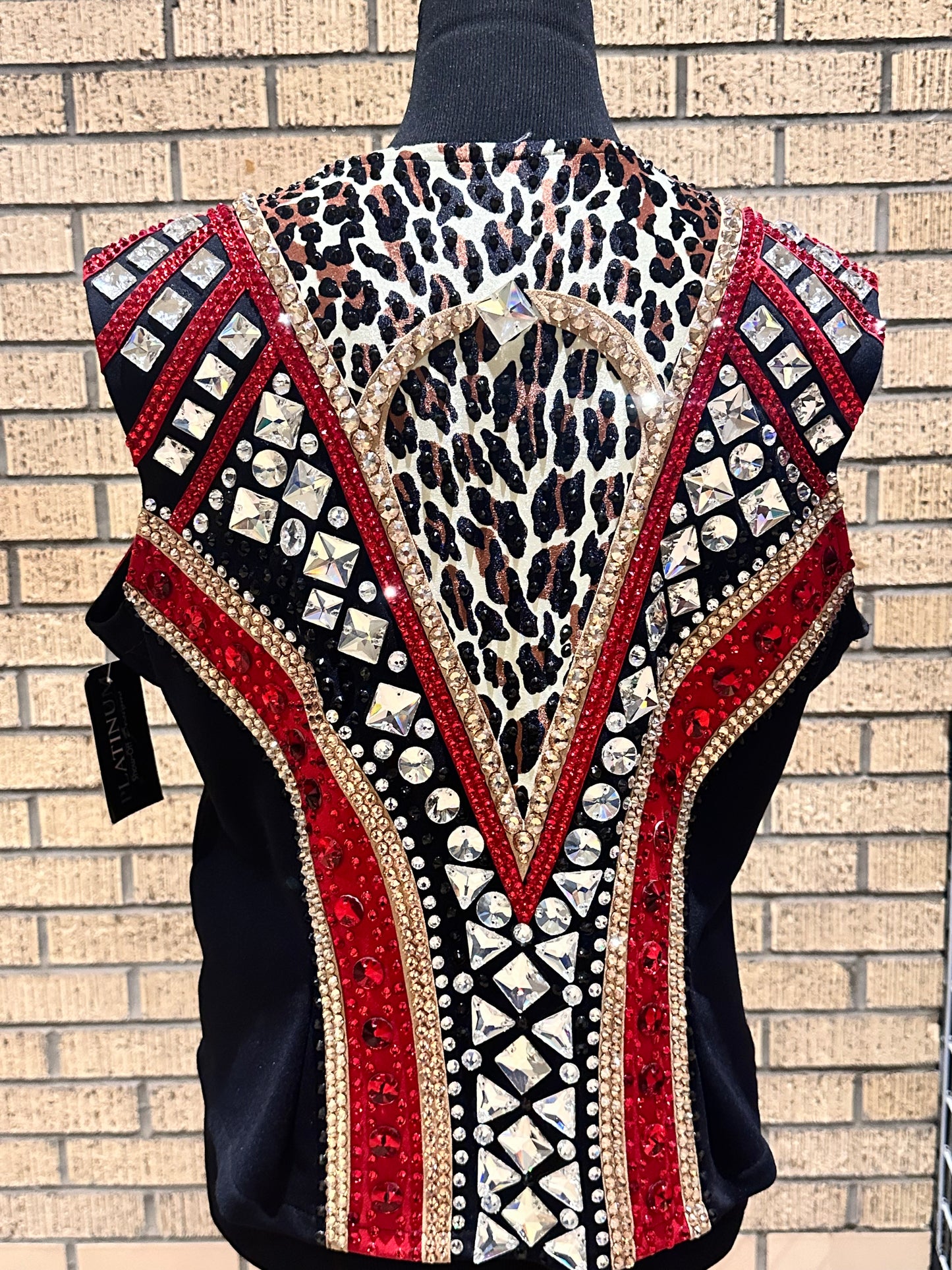Large vest with black, gold and red with clear crystals and leopard print
