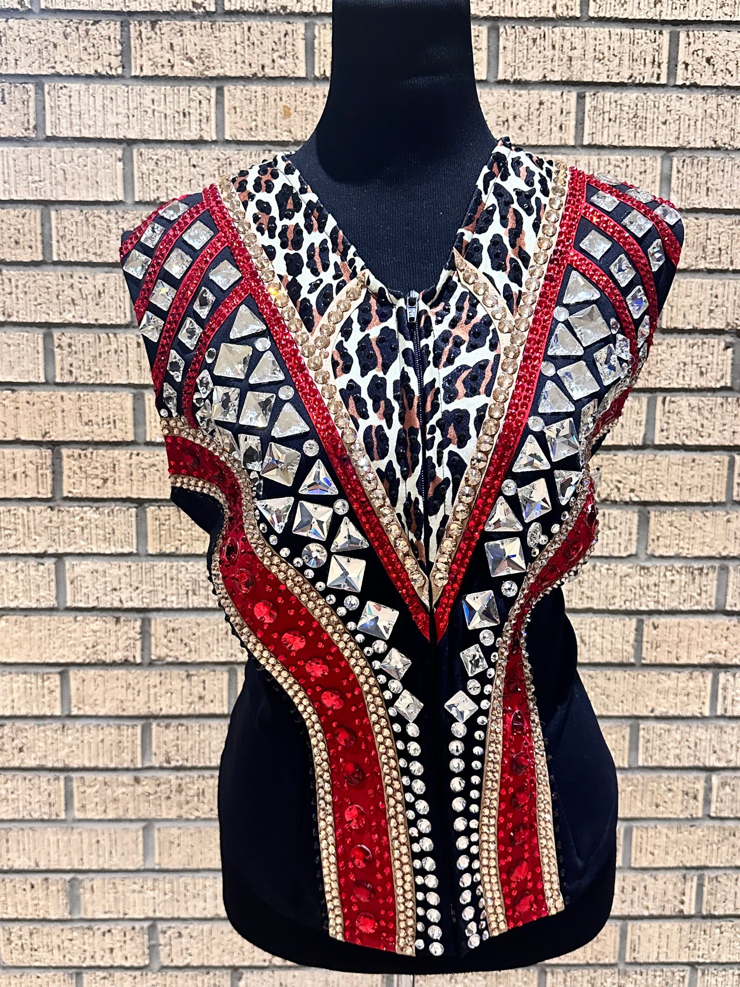 Large vest with black, gold and red with clear crystals and leopard print