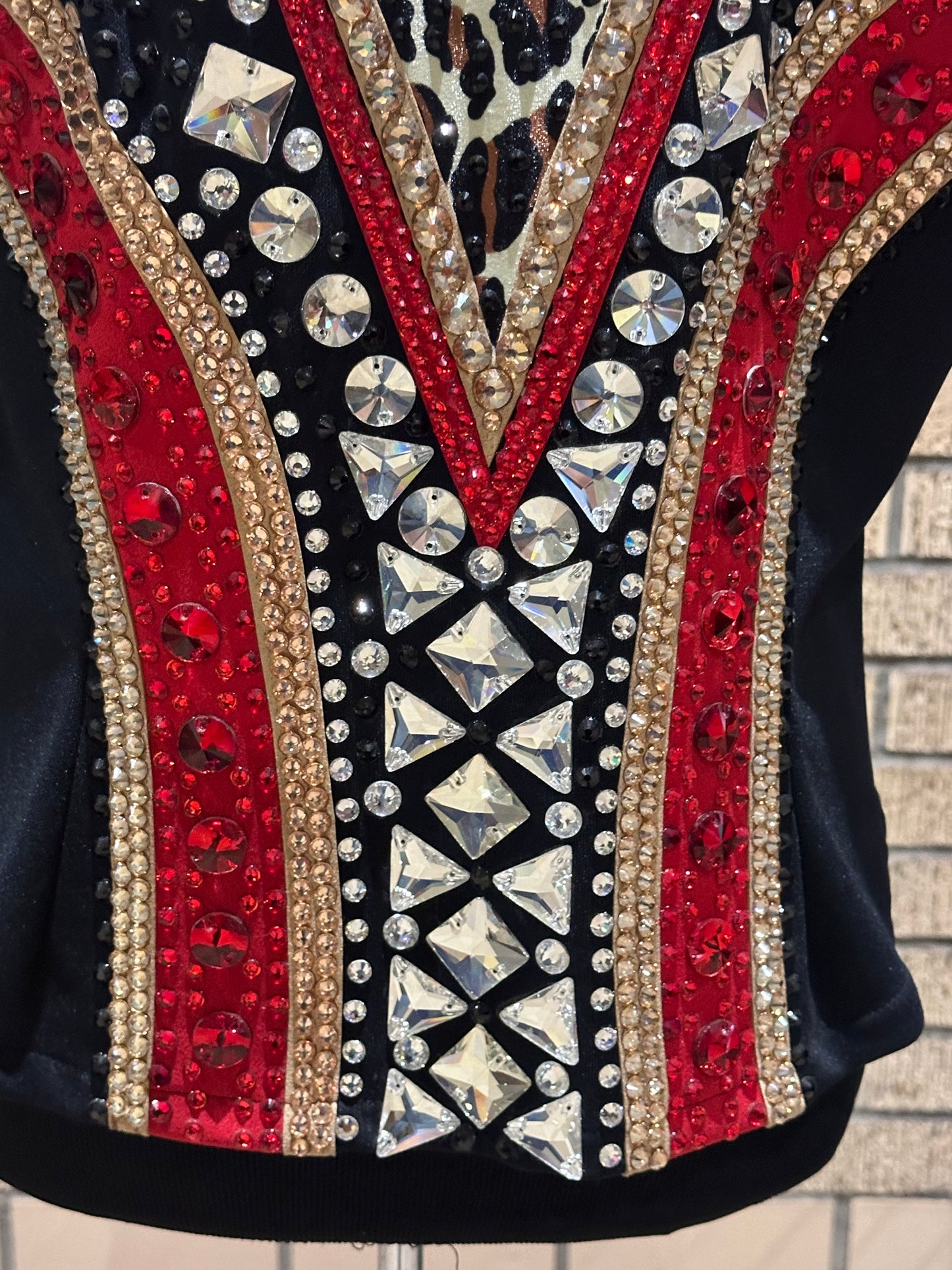 Large vest with black, gold and red with clear crystals and leopard print