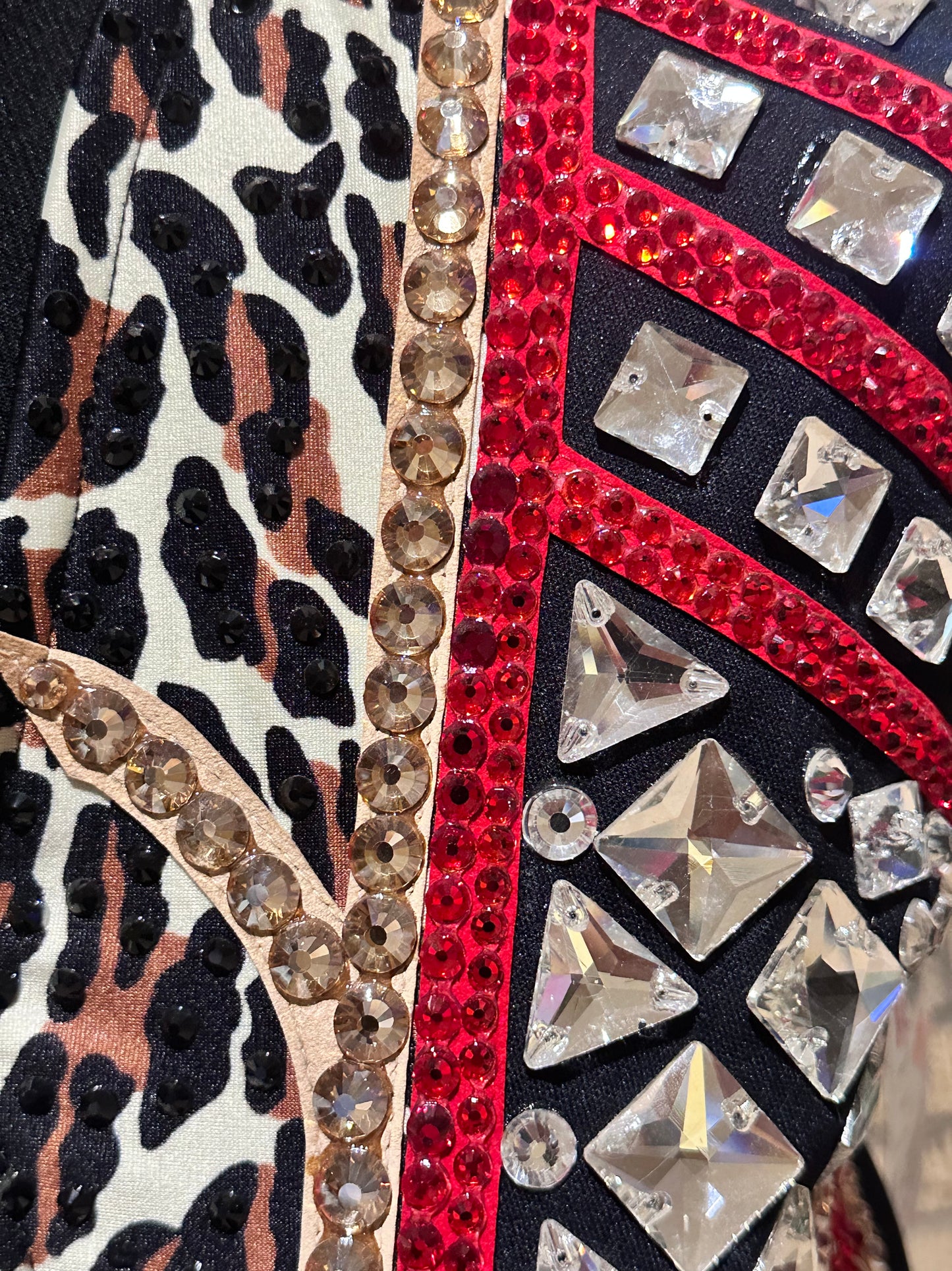 Large vest with black, gold and red with clear crystals and leopard print