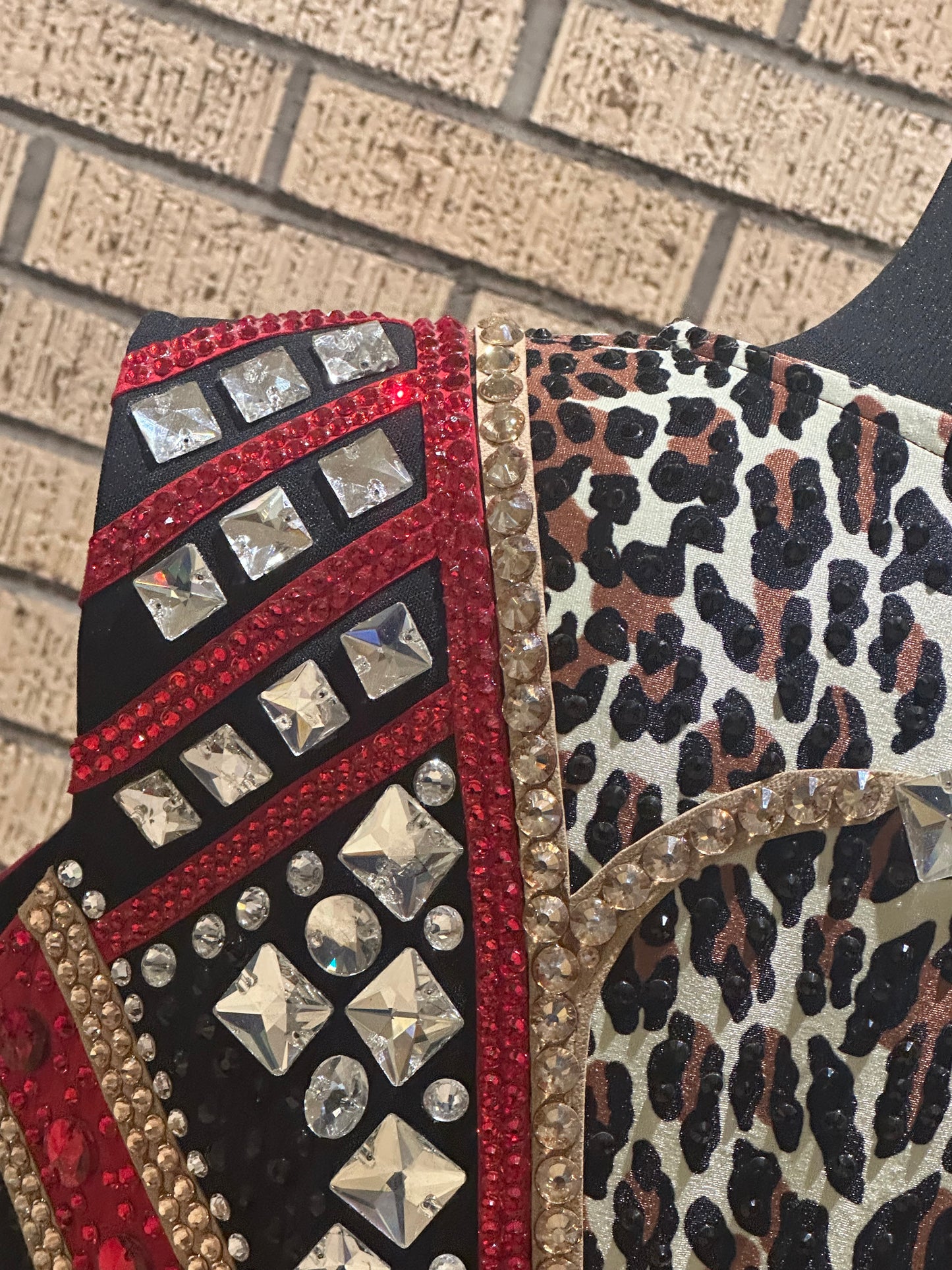 Large vest with black, gold and red with clear crystals and leopard print