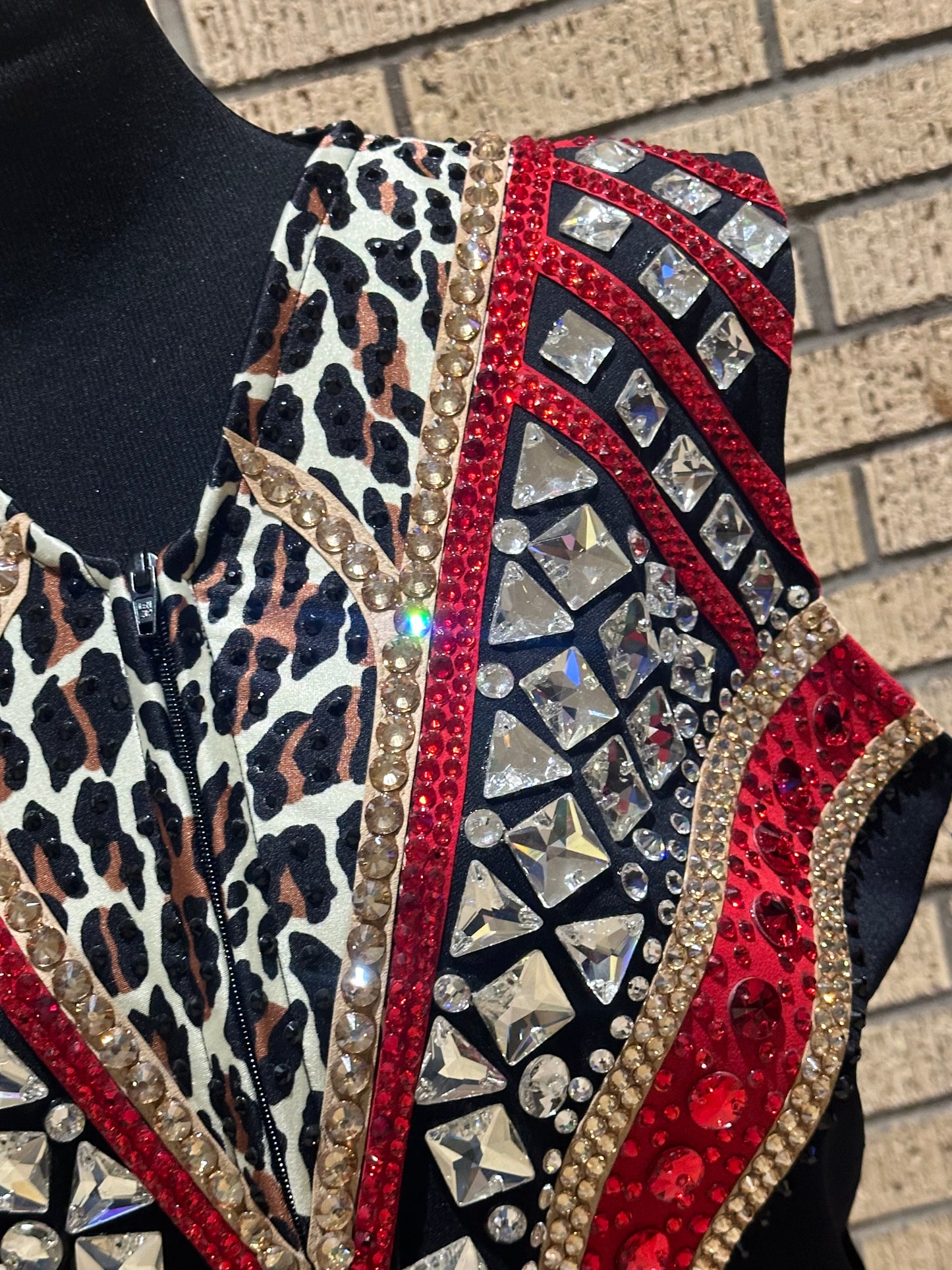 Large vest with black, gold and red with clear crystals and leopard print