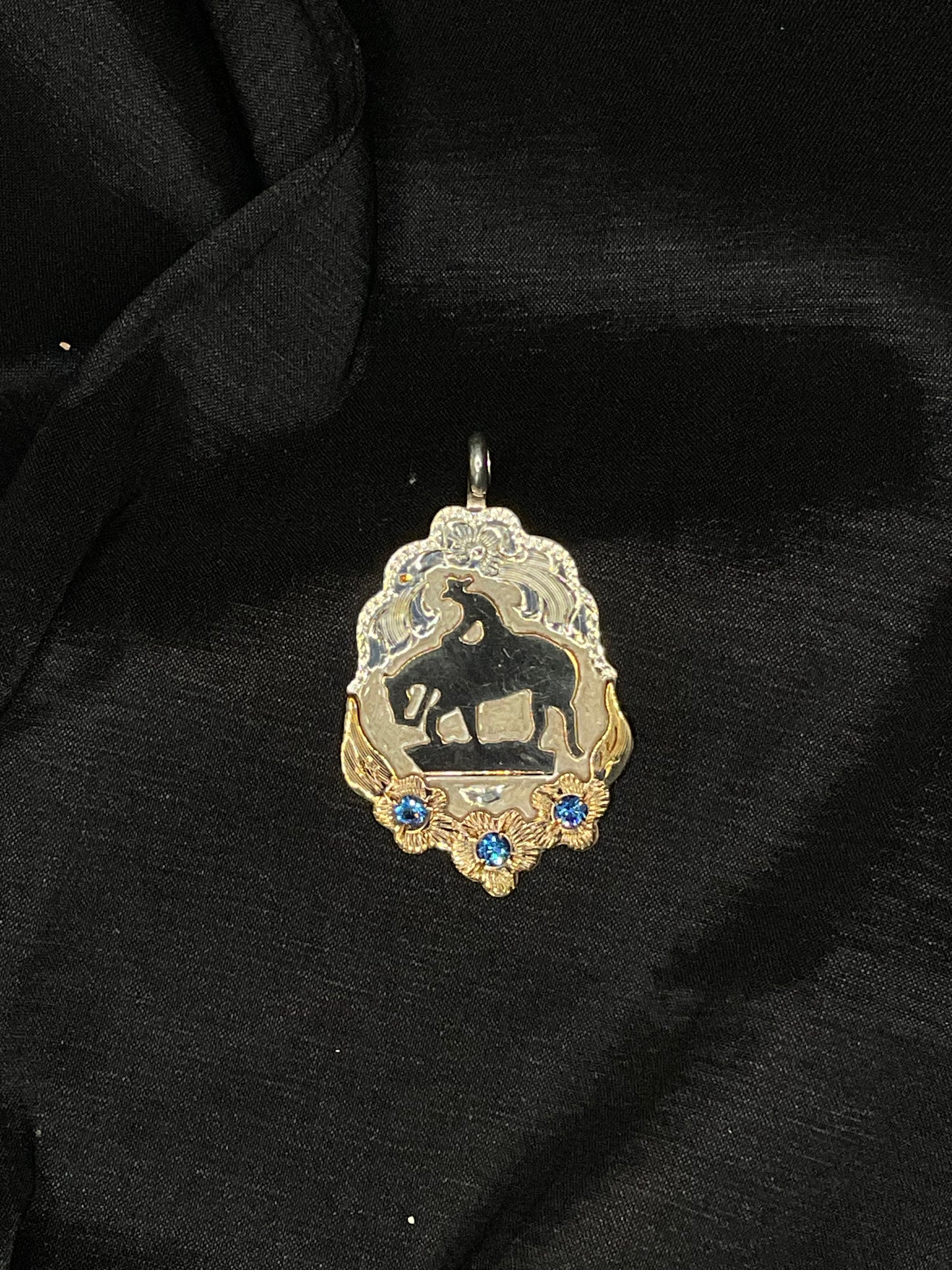 Silver By Wanda #8B  P36TB Trail horse pendant with gold floral design and blue cz stone