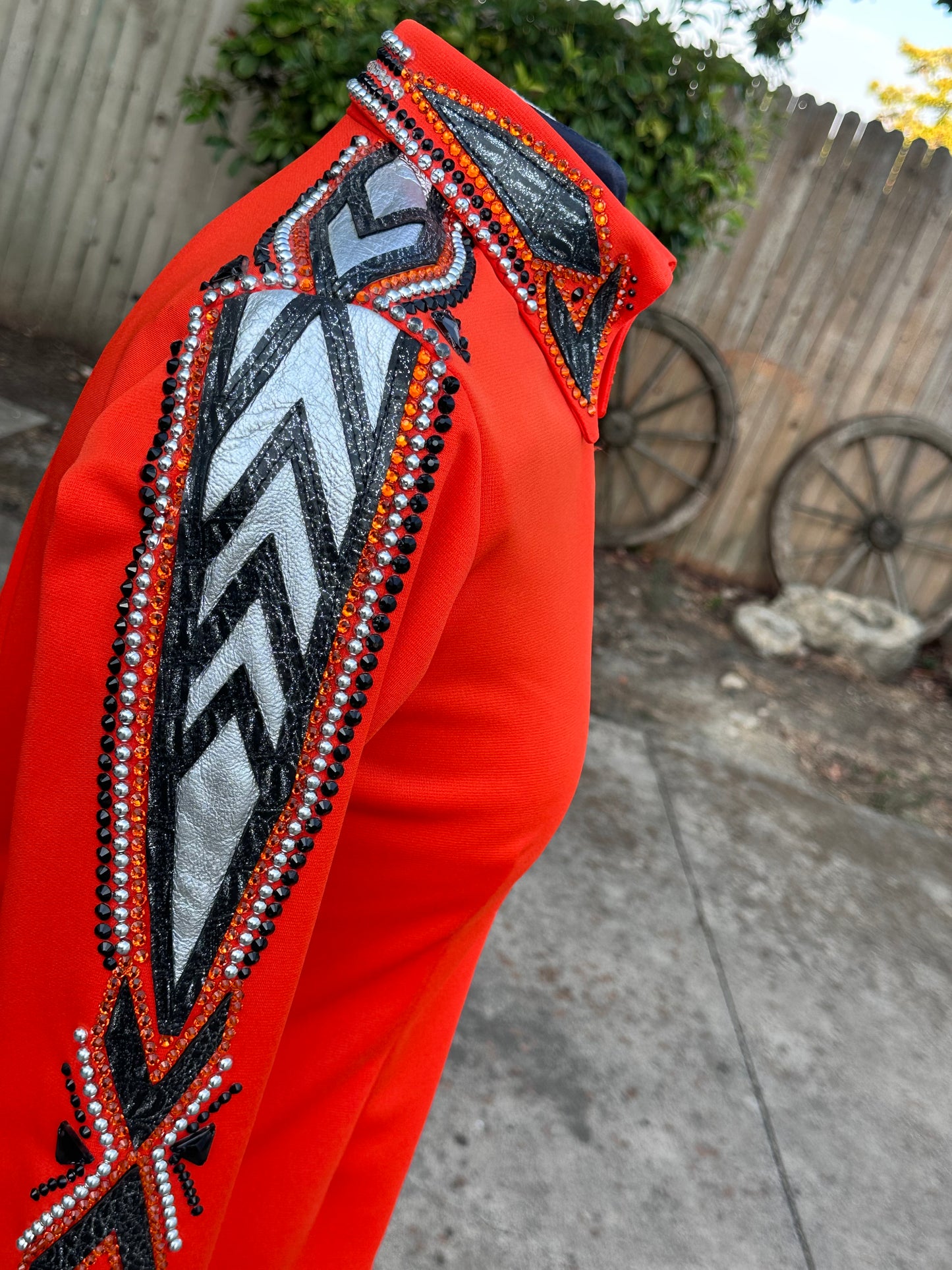 Size small day shirt bright orange, black and silver