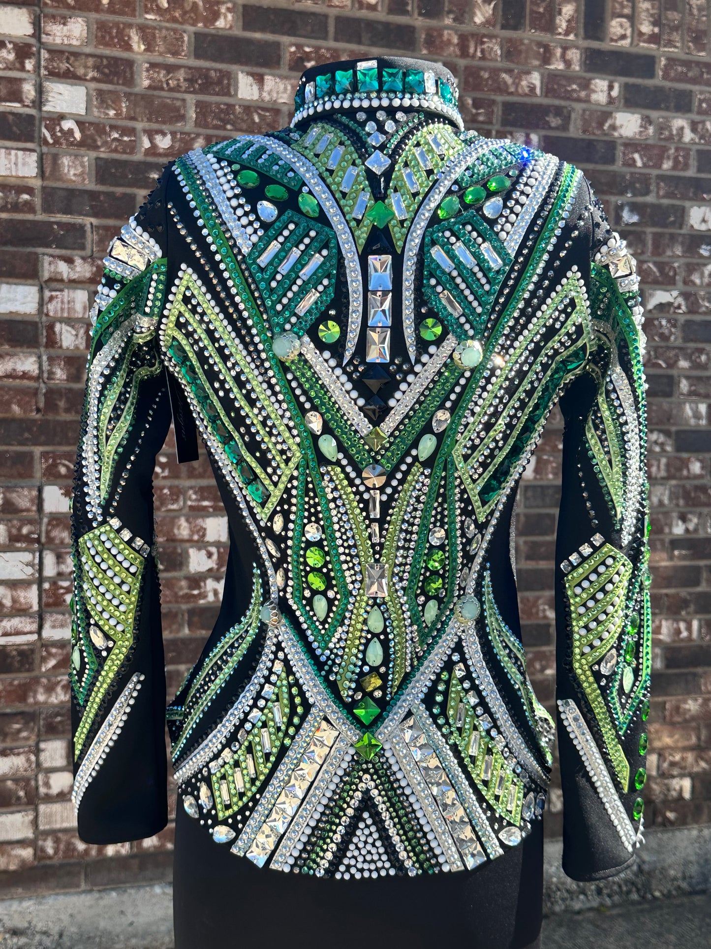Small Showmanship Jacket black base with multiple shades of green, white and silver
