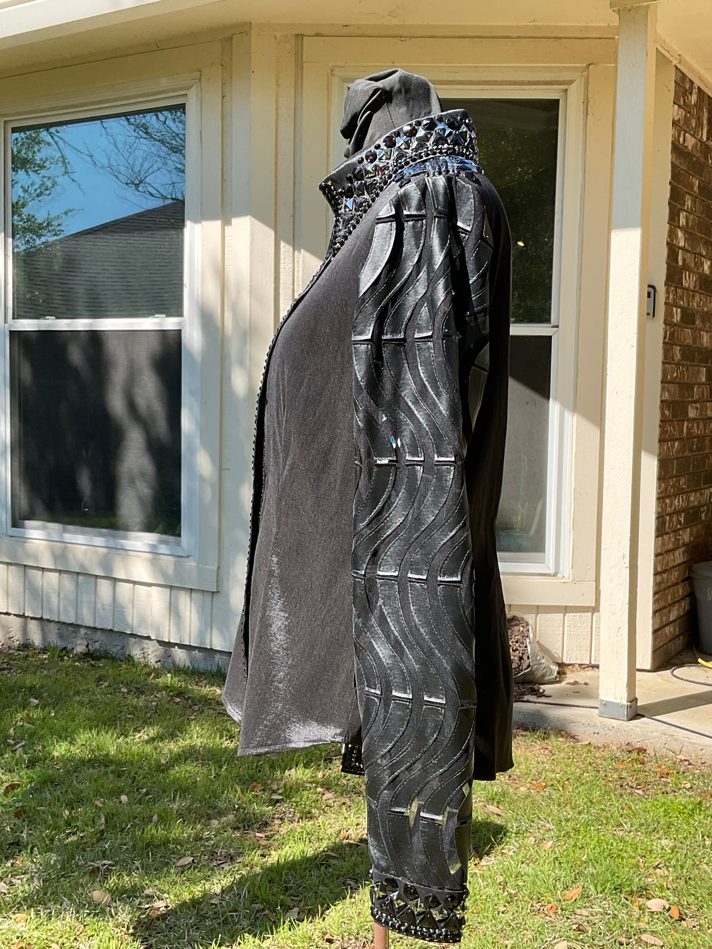 Size medium Black stretch taffeta with lace and leather sleeves, metallic sliver