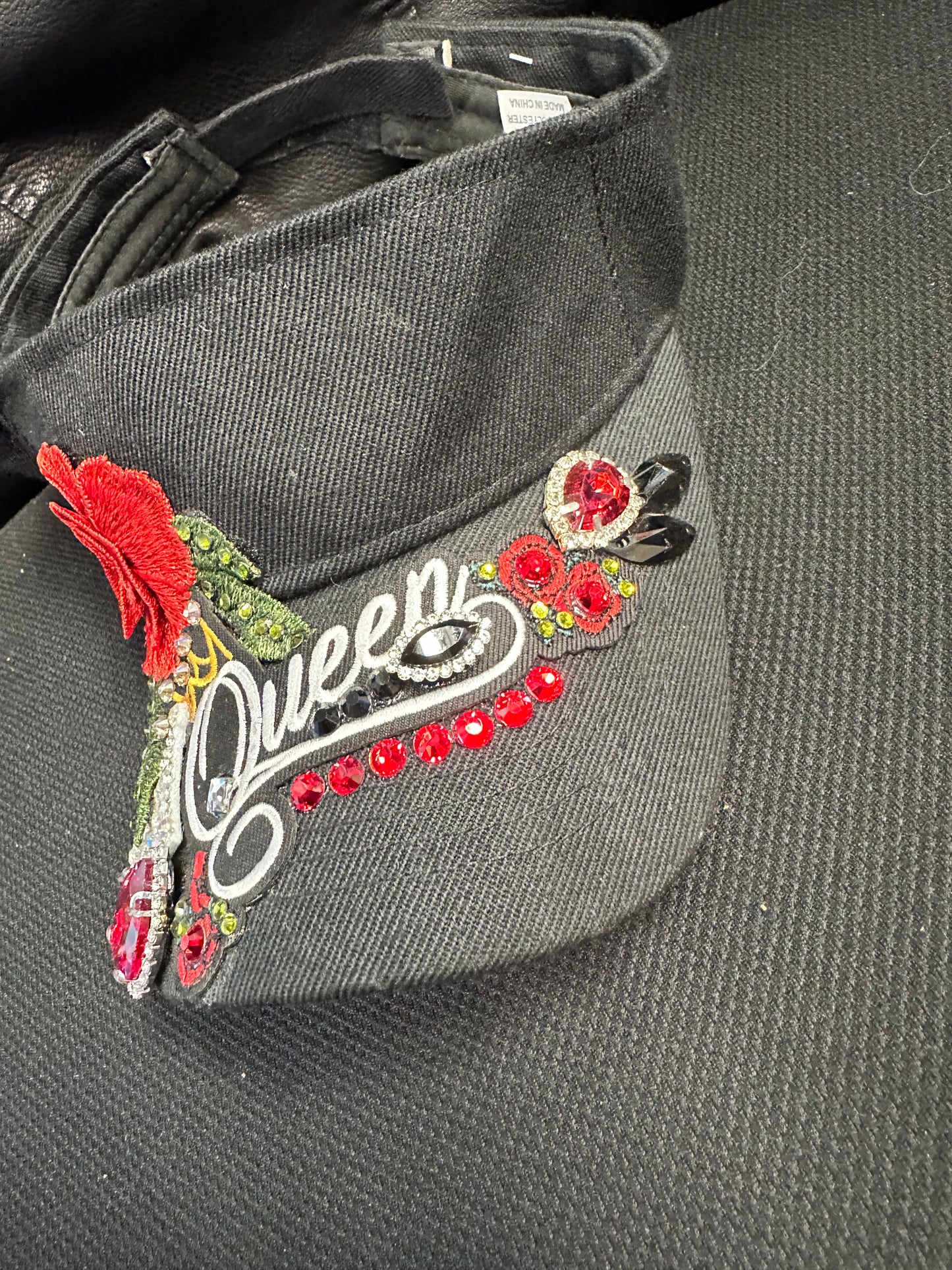 Fancy black and red Visor with one of a kind QUEEN design