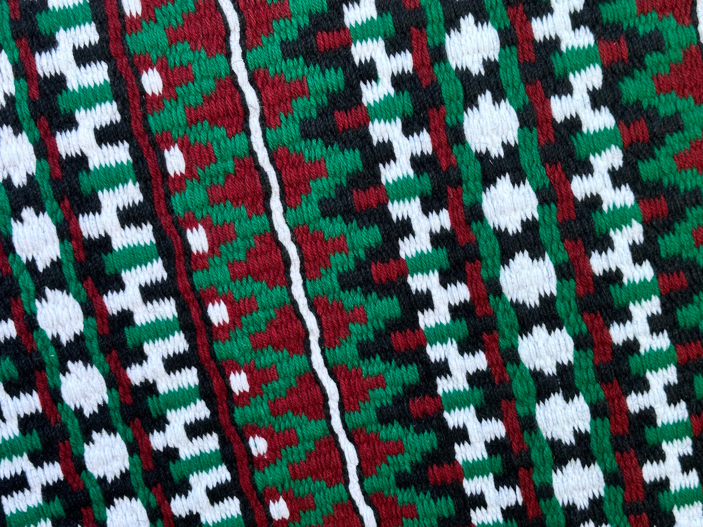42. Oversized saddle blanket black Kelly green Tibetan red white