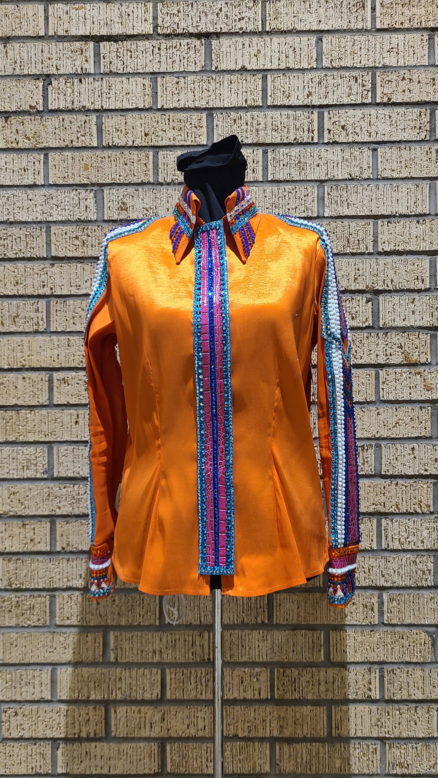 Size medium stretch orange taffeta with blue, turquoise, purple design. White and silver accents