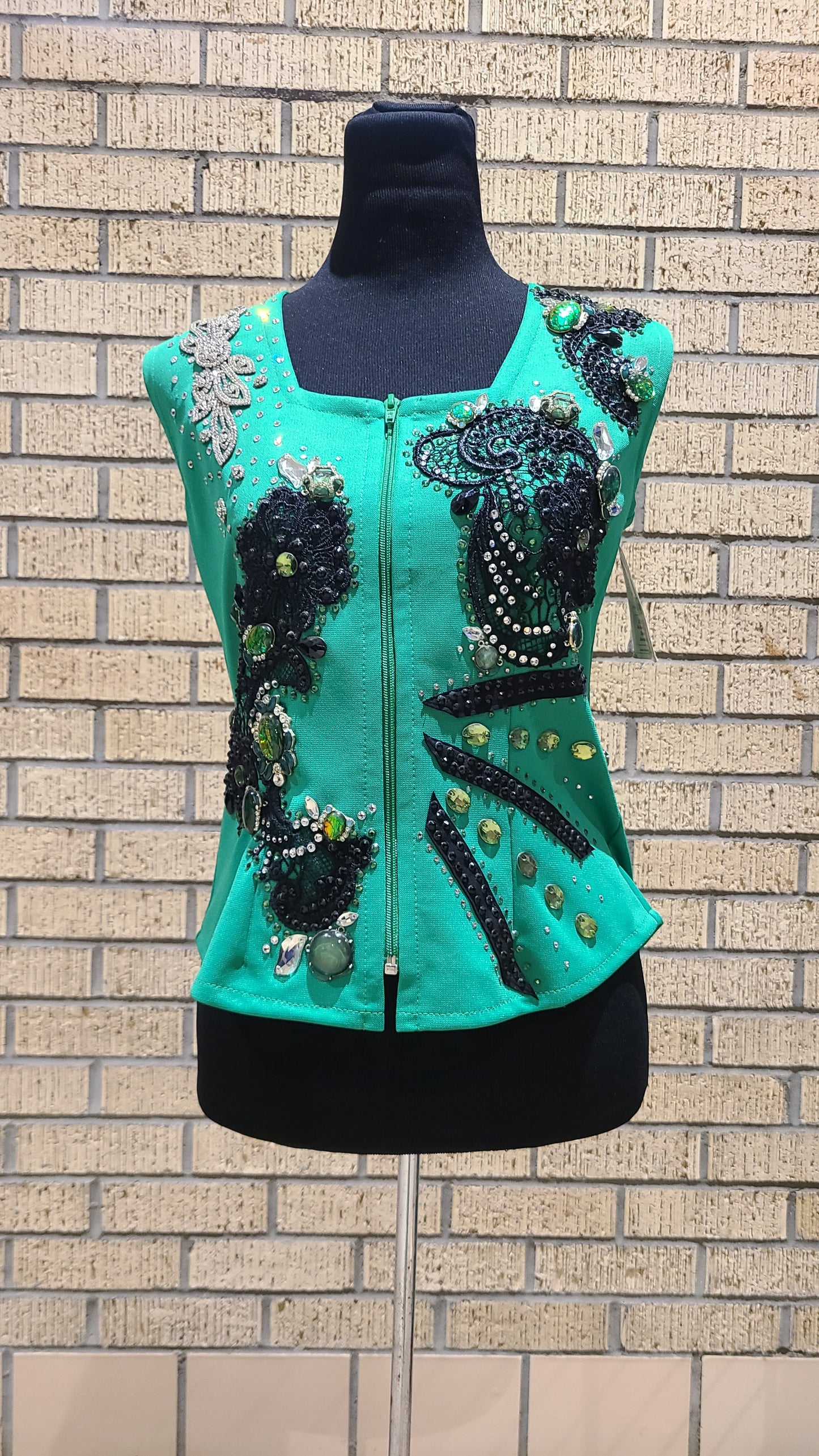 Size small vest green, black and clear design